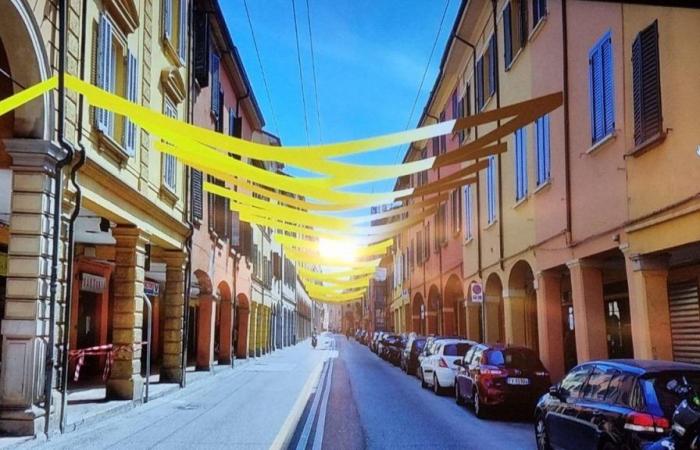 Where the Tour de France passes in Bologna, the streets are already colored yellow