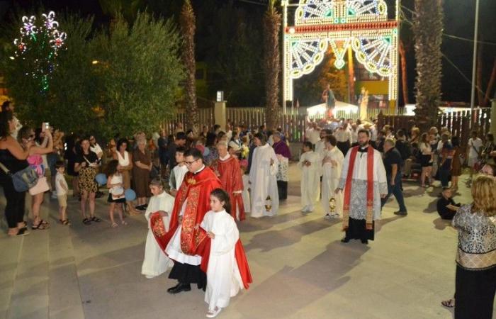 the neighborhood is crowded with devotion to the saint