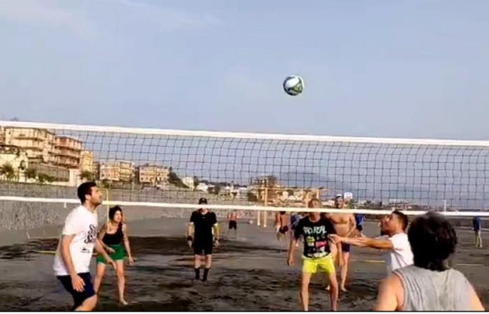 playing football and volleyball on a real pitch on a beach in Portici”