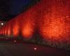 The ancient walls of Como are colored red. And there is also the flash mob in Piazza Duomo