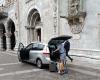 Swiss tourists park their cars in front of the Cathedral of Como. Reason? Convenient for luggage